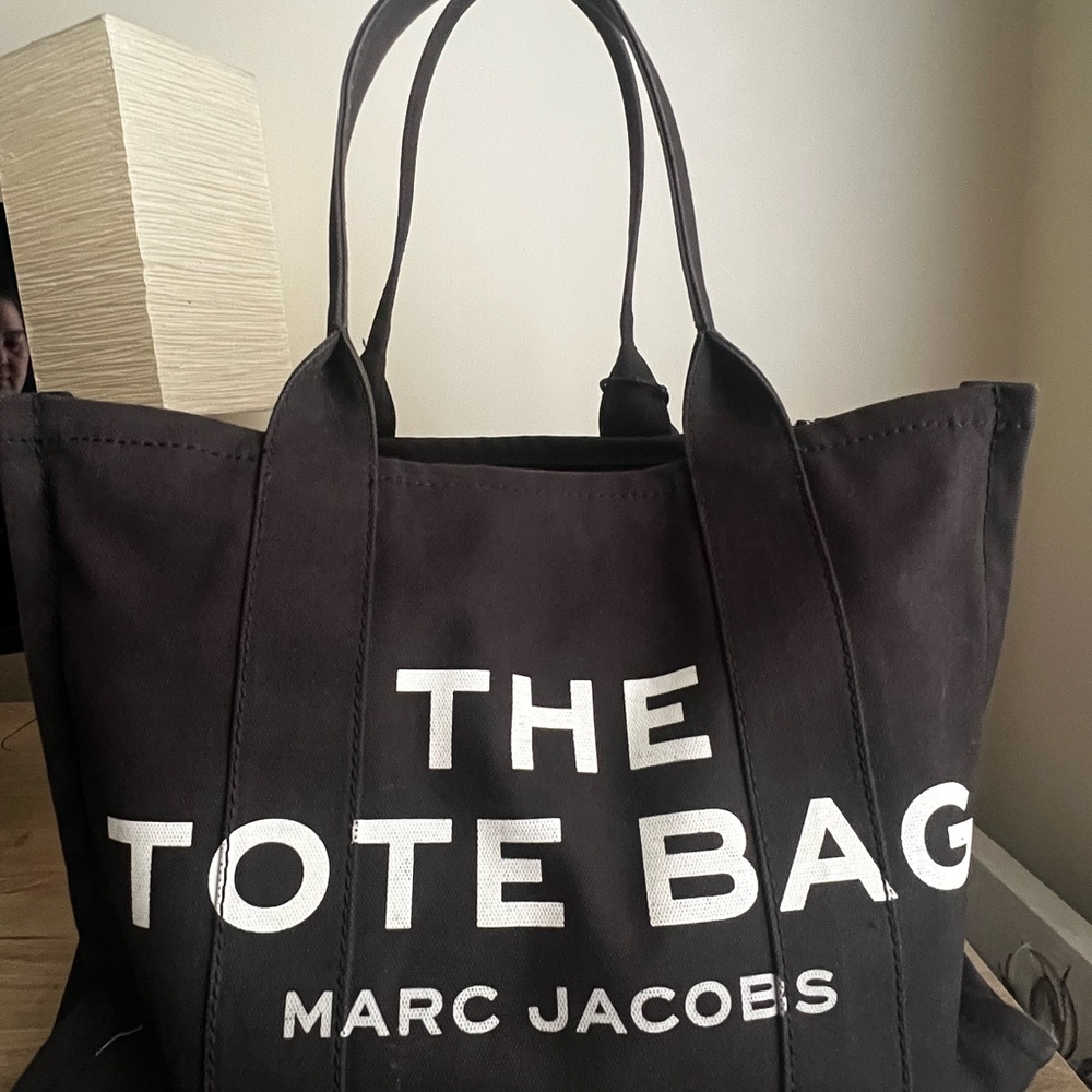 Pre owned Marc Jacobs Black Canvas Tote, a few marks inside, handles and .